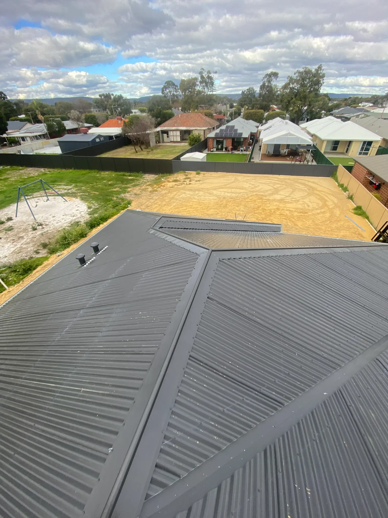 Completed charcoal roof with detailed roofline
