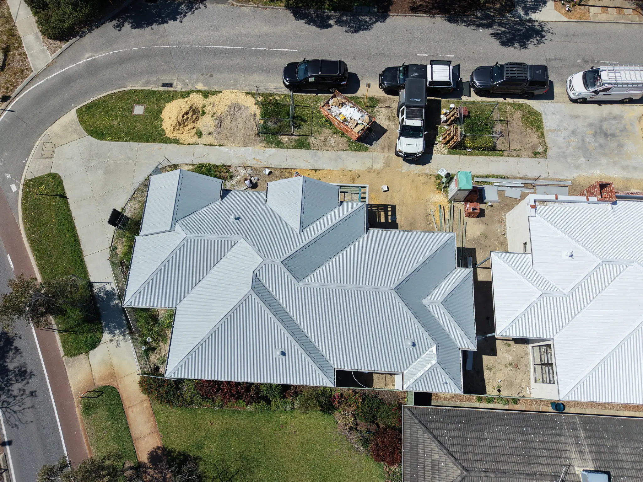 Aerial overview of a completed residential metal roof