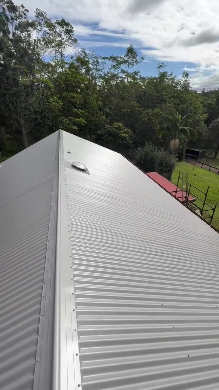 Completed metal re-roof with custom flashing